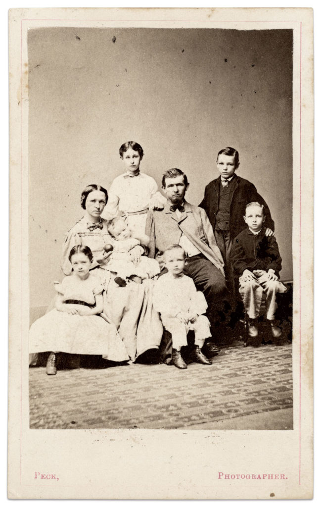 Warner and his family. Carte de visite by Henry S. Peck of New Haven, Conn. Author's collection.