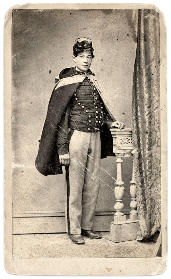 James H. Baird of the 3rd’s Company B wears his hooded cloak folded back to show off its red lining. His headgear consists of a forage cap with waterproof cover, rather than the pillbox cap worn by his regiment for full dress. Carte de visite by an unidentified photographer. Ronald S. Coddington Collection. 