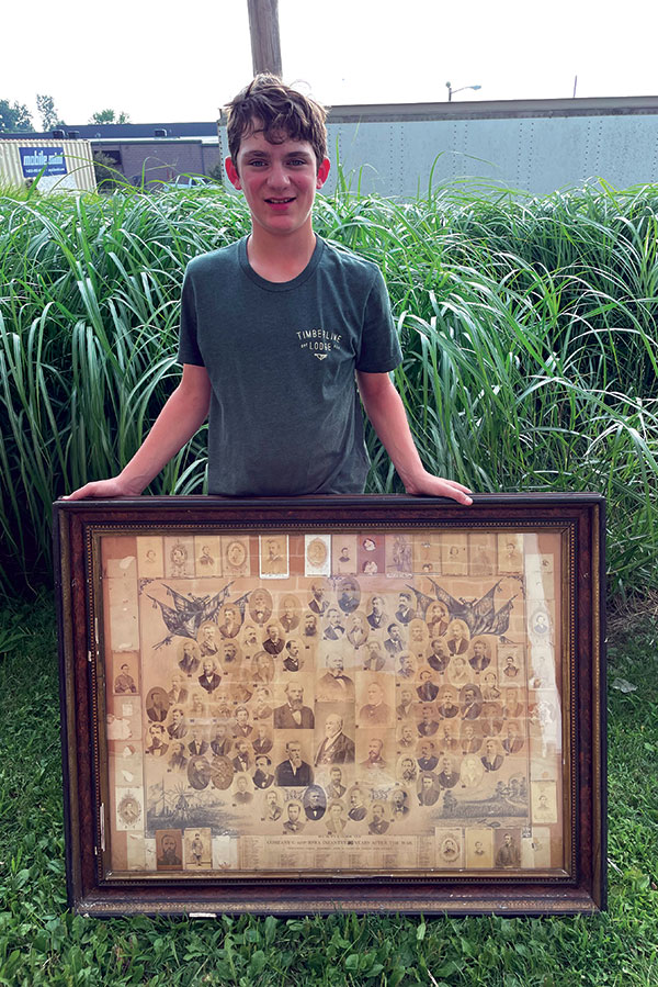 Caedyn Huston, the author’s son, holds the composite before preservation. His fourth great-grandfather, Marshall Wilkin, is one of the members pictured. The post-conservation digital image shown here includes a carte de visite of Cpl. James H. Young along the left center edge purchased by the Prairie Grove Battlefield State Park prior to the author’s acquisition of the composite. Courtesy of the author.