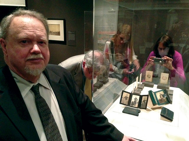 McAfee stands beside a display case containing part of his collection at the opening night exhibit of Photography in The American Civil War at the Metropolitan Museum of Art in April 2013. Courtesy of Thomas Harris.