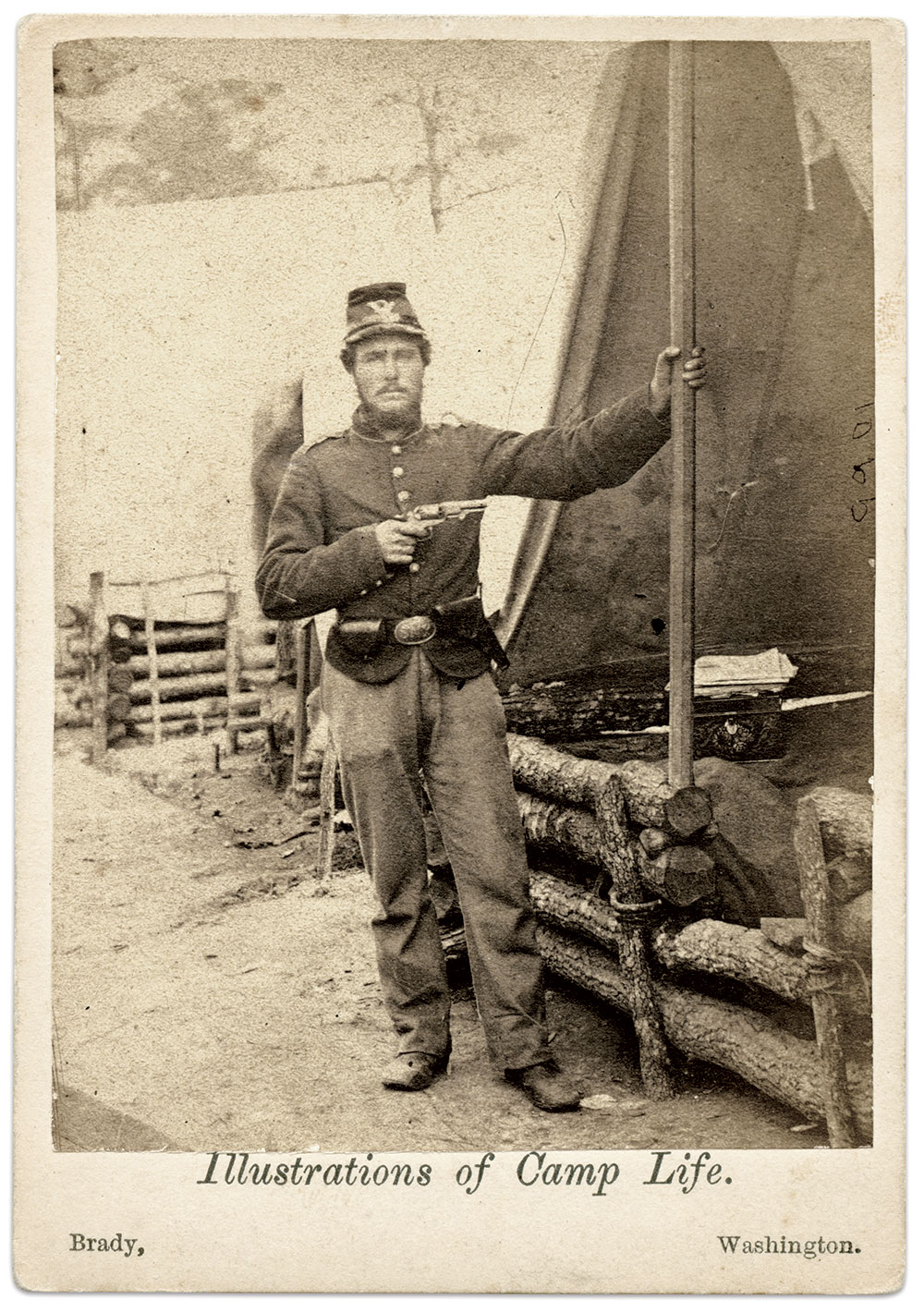 Figure 9: New York soldier with pistol at tent, 1861-62. Albumen silver print from glass negative. Rick Brown Collection of American Photography.