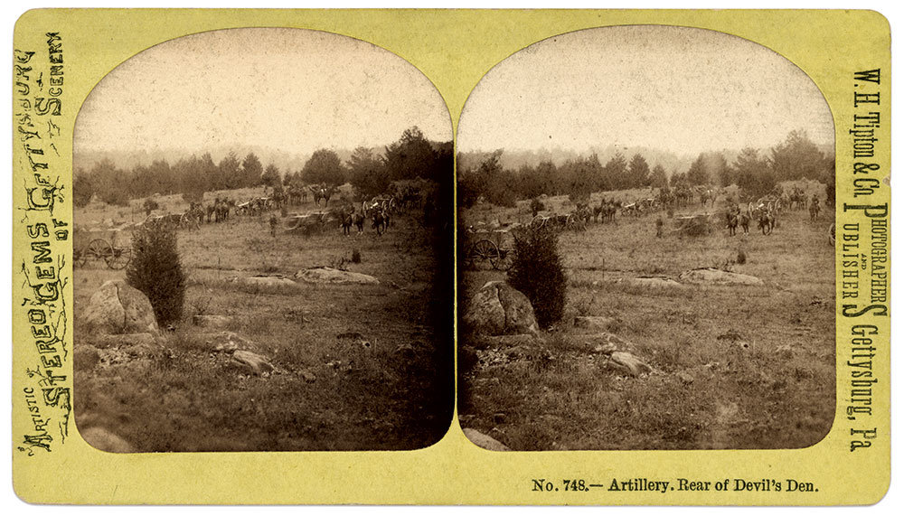 This view of Houck’s Ridge looking northeast in the direction of main Union line of battle, is believed to date to July 1865 when elements of the army participated in the dedication of the cornerstone of the Soldiers’ National Monument. Note the distinctive rock in the left foreground: It marks the approximate position of the 10th and 11th U.S. in the middle of Burbank’s line. Stereo card by W.H. Tipton & Co. of Gettysburg, Pa.