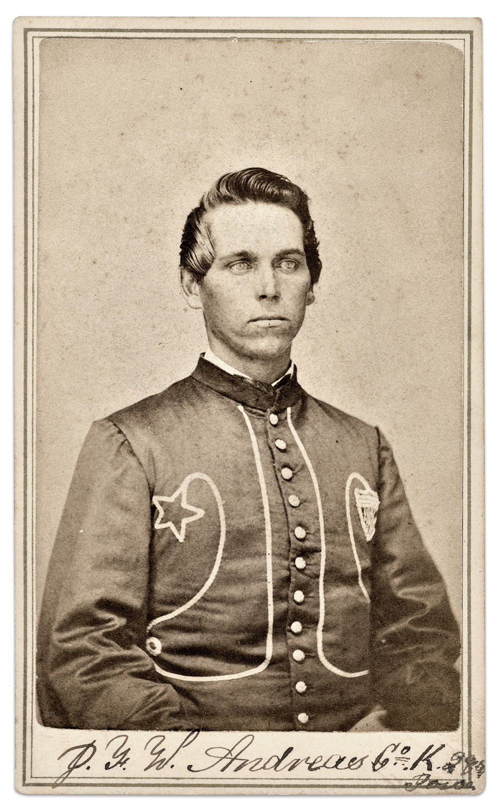The smaller looping along the bottom and back of the jacket is visible in this portrait of Pvt. John F.W. Andreas (about 1841-1864) of Company K. Andreas lost his life in the Third Battle of Winchester. Carte de visite by an unidentified photographer. Mark Warren Collection.