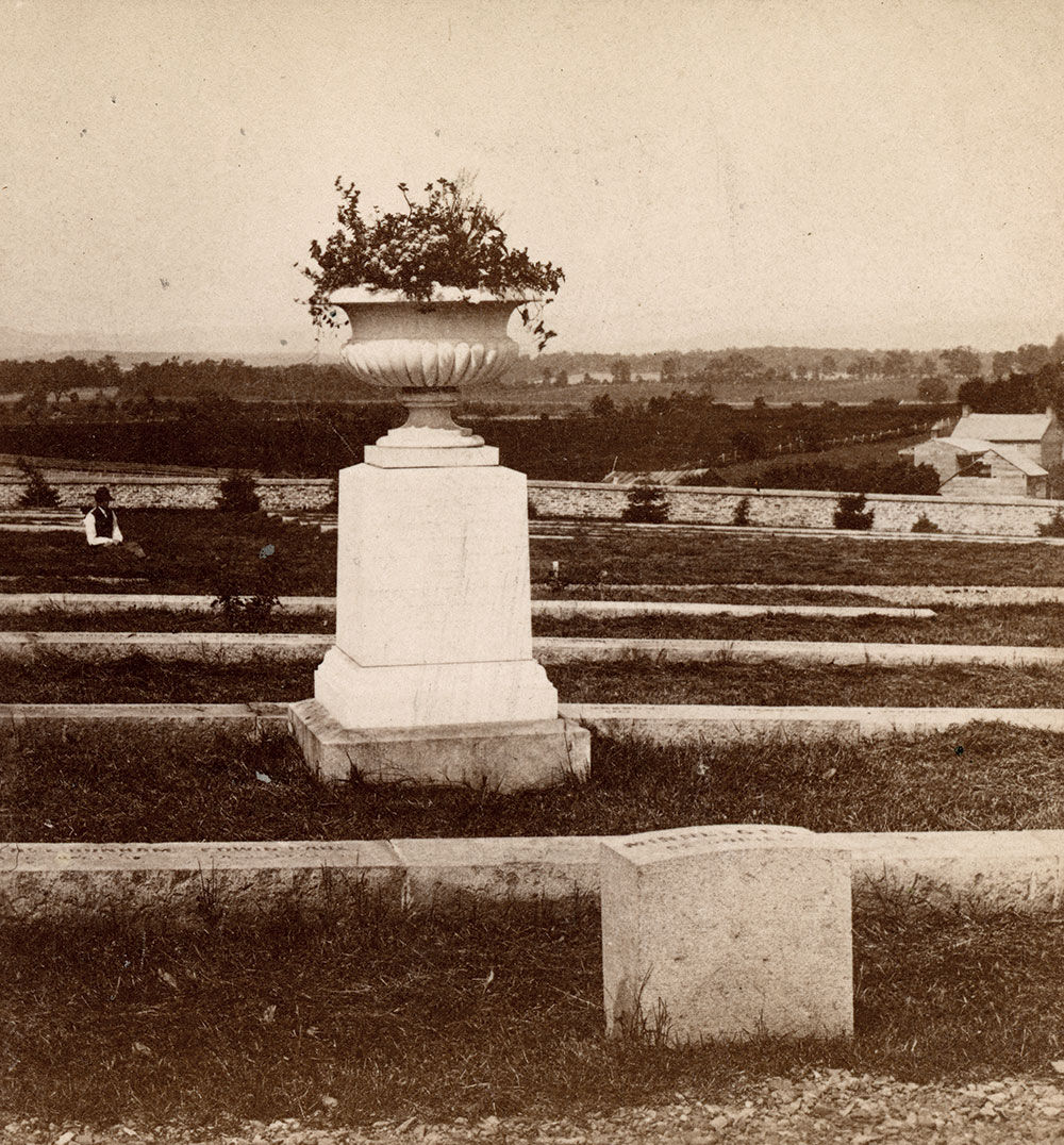 View of the monument and graves of the 1st Minnesota Infantry, circa 1869. Today, the open panorama is obscured by ornamental trees and shrubbery. This stereo card detail is No. 590 in Tipton’s “Battlefield of Gettysburg” series. Stereo card by W.H. Tipton & Co. of Gettysburg, Pa.