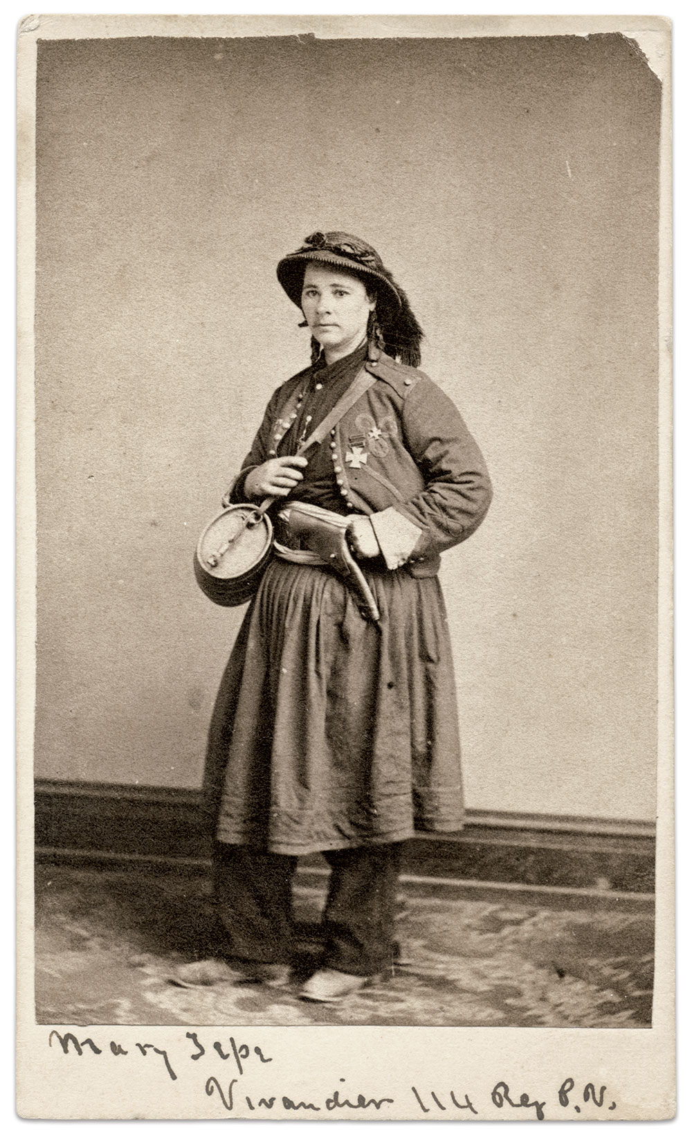 Marie stands proud in her trademark Zouave-inspired outfit, holding her iconic keg, pistol on her hip at the ready. She wears the Kearny Cross, awarded to her for bravery at the Battle of Chancellorsville. Carte de visite by Robert W. Addis of Washington, D.C. The Liljenquist Family Collection at the Library of Congress.