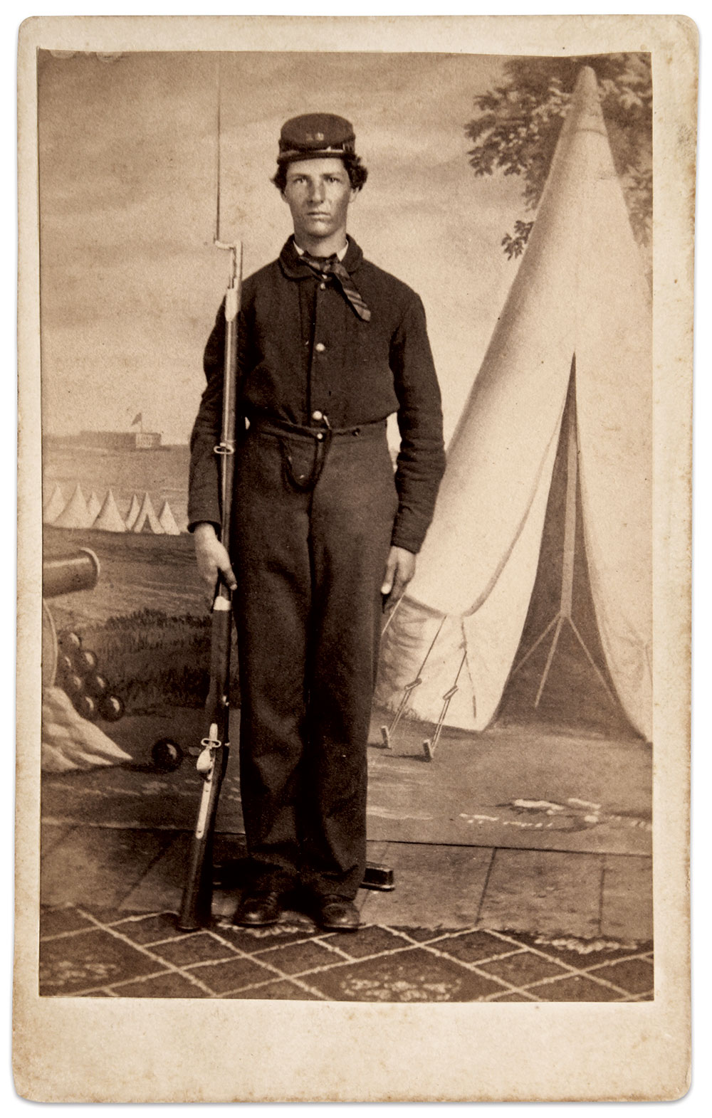 Two portraits by the Moore Brothers, a sixth-plate tintype (enlarged and reversed for comparison) and a carte de visite feature the camp scene I surmise Nelson Moore painted.