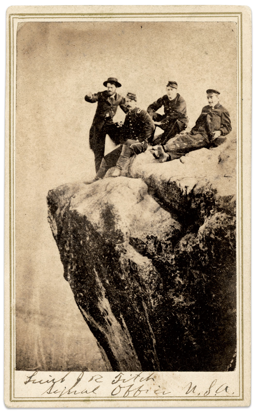 Second Lt. Julian R. Fitch points over the shoulder of Quinby while a Capt. Taylor and Edwin D. Westfall (1839-1879), a correspondent for the New York Herald, look on. Carte de visite by Robert M. and James B. Linn of Lookout Mountain, Tenn., copied by J.P. Marshall & Co. of Leavenworth, Kan.