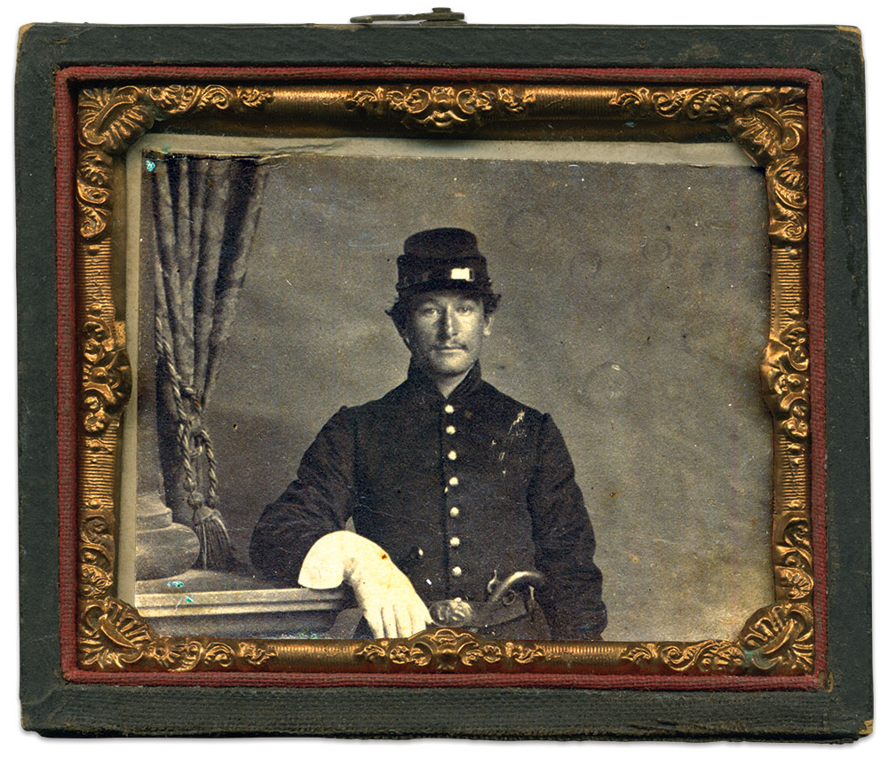 Henry in late 1861 or early 1862, posed with a single shot “boot pistol.” Carte de visite by an unattributed Washington, D.C., photographer.