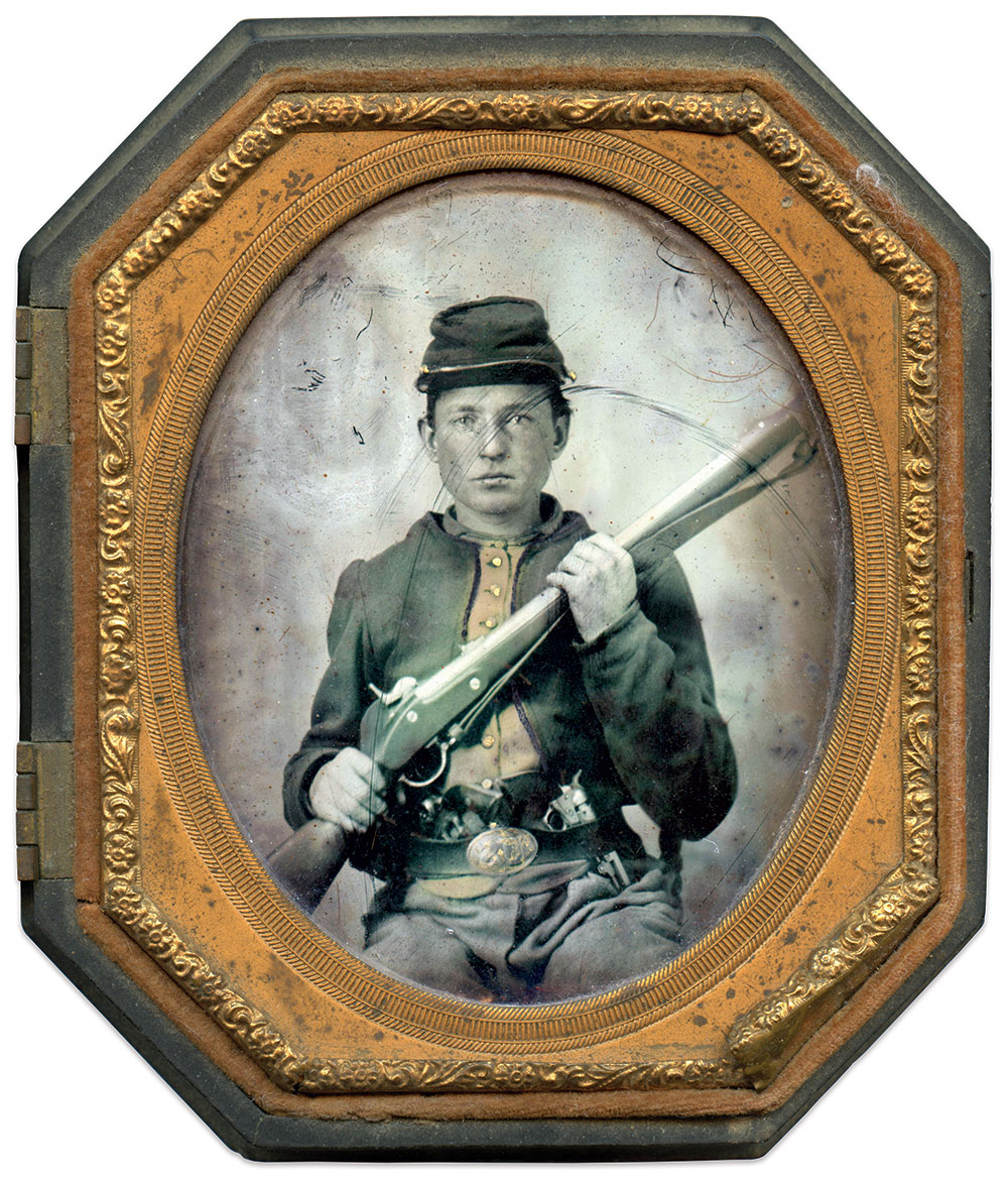 The integral vest attached to this Zouave’s second-pattern jacket has been colored pale orange, which may indicate a variation in color of this part of the garment. He holds a Model 1855 rifle, and has two Colt Model 1849 Pocket revolvers tucked in his waist belt, which is fastened with a Pattern 1839 oval US plate. Sixth-plate ambrotype by an unidentified photographer. Rick Brown Collection of American Photography.