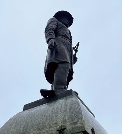 The edge of Brown’s hatchet is just visible next to his foot at the base of the regiment’s Gettysburg memorial. Military Images.