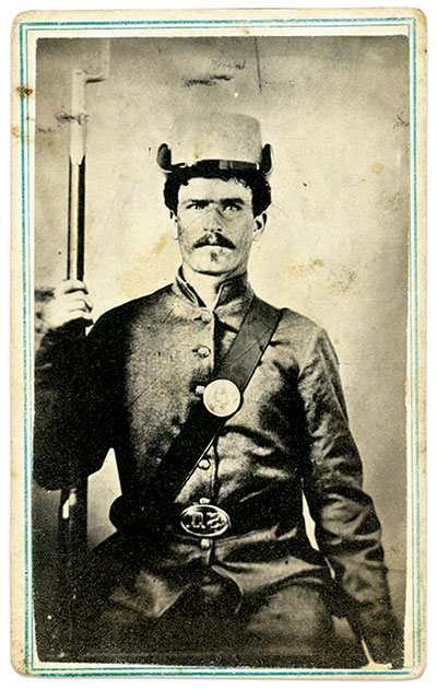 This gray-clad volunteer of the 3rd Wisconsin Infantry has the brim of his Havelock hat turned up. Carte de visite by John Robertson of Ilotteville, Wis. Collection of the late Michael J. McAfee.